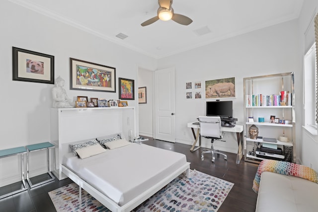 bedroom with dark hardwood / wood-style floors, ceiling fan, and crown molding