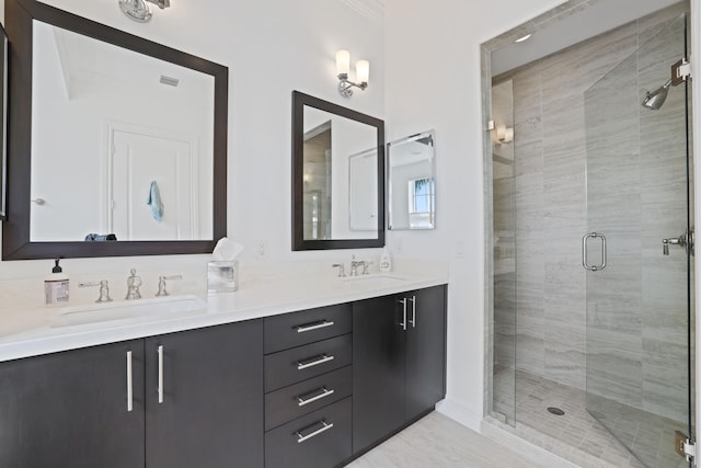 bathroom with vanity and an enclosed shower