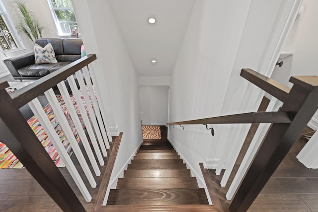 staircase with wood-type flooring