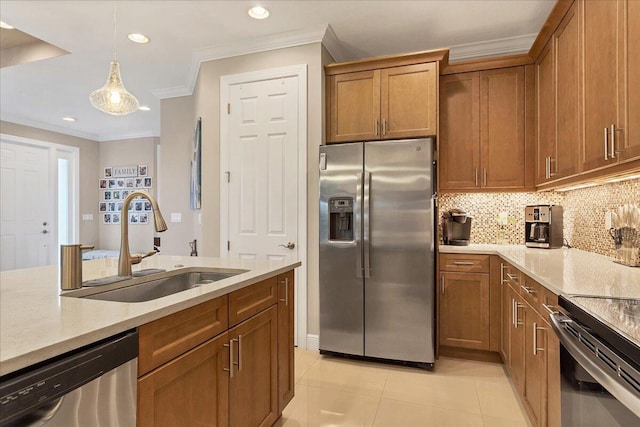 kitchen with tasteful backsplash, sink, hanging light fixtures, stainless steel appliances, and light stone counters