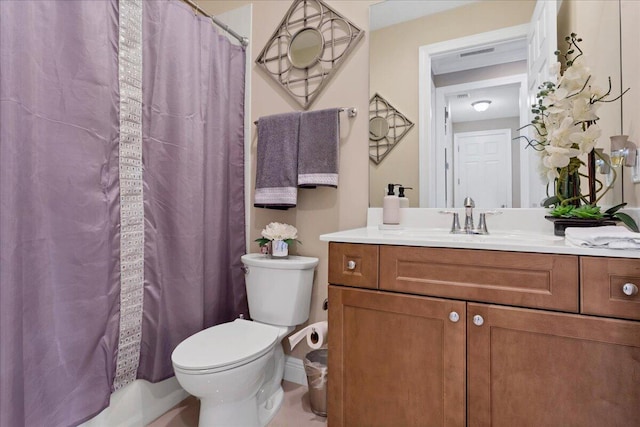 bathroom featuring toilet, visible vents, and vanity