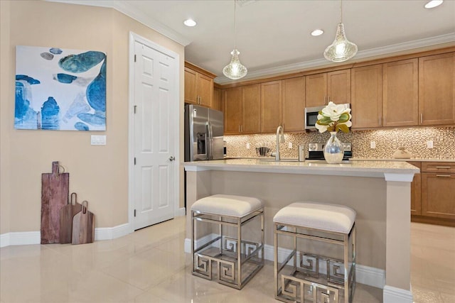 kitchen with appliances with stainless steel finishes, light countertops, crown molding, a kitchen bar, and backsplash