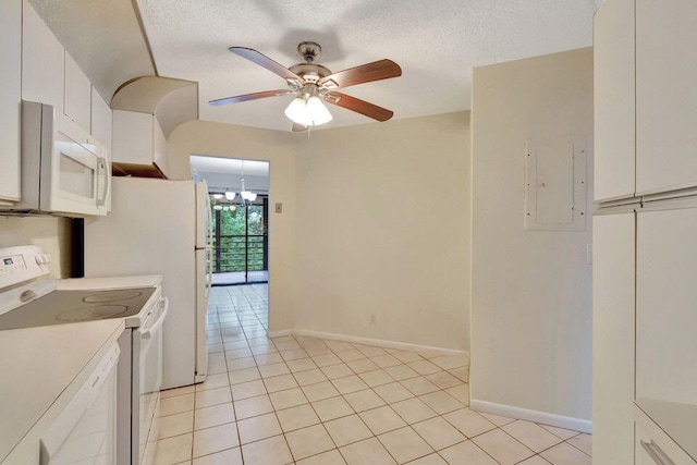 kitchen with range with electric stovetop, ceiling fan, white cabinetry, and light tile patterned floors