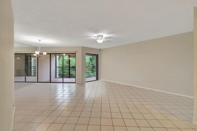 empty room featuring a textured ceiling, ceiling fan, and light hardwood / wood-style flooring