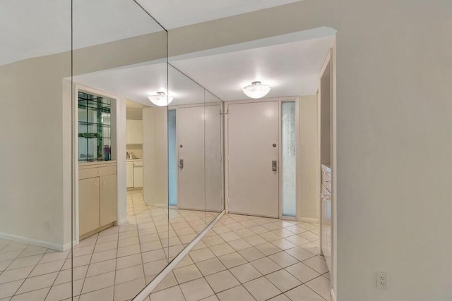 entrance foyer with light tile patterned floors