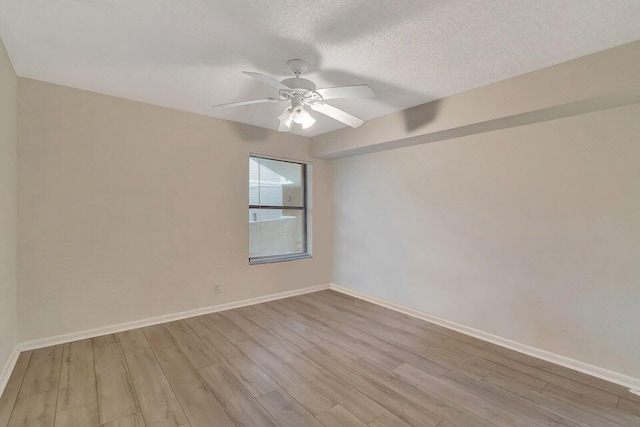 unfurnished room with ceiling fan, a textured ceiling, and light hardwood / wood-style floors