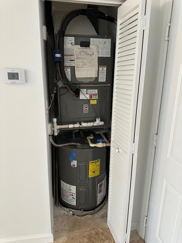 utility room featuring heating unit