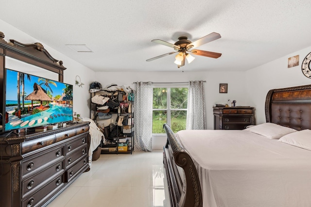 bedroom featuring a textured ceiling and ceiling fan