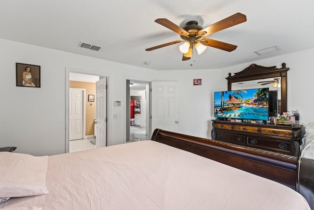 bedroom featuring a textured ceiling and ceiling fan