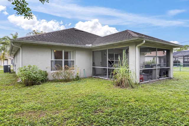 back of house with a yard, central AC, and a sunroom