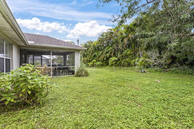 view of yard with a sunroom