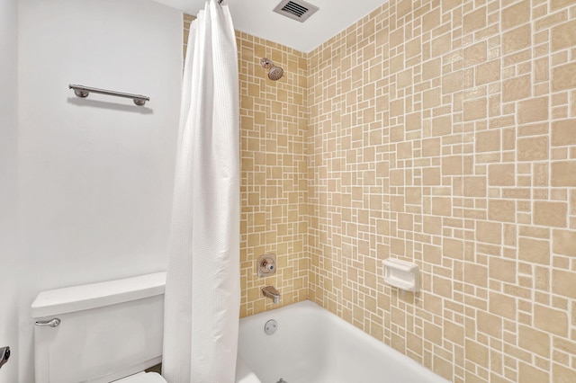 full bathroom featuring toilet, shower / tub combo, and visible vents