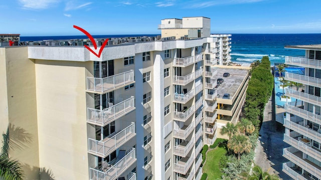 view of building exterior featuring a water view