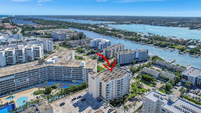 birds eye view of property with a water view