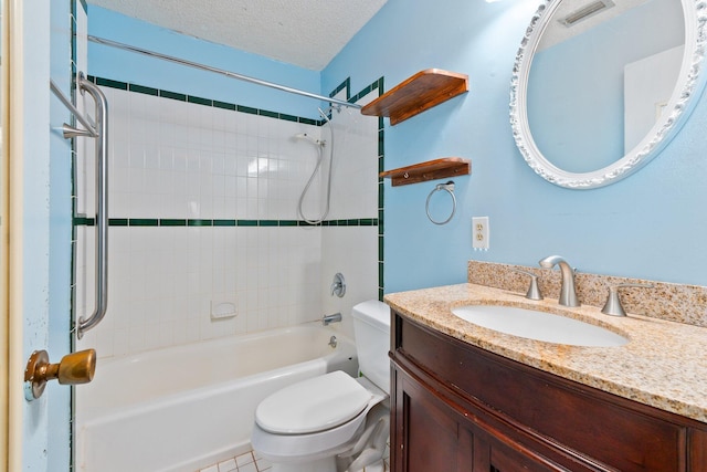 full bathroom featuring tile patterned floors, vanity, a textured ceiling, toilet, and tiled shower / bath