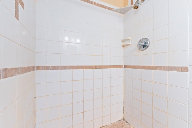 bathroom with a tile shower