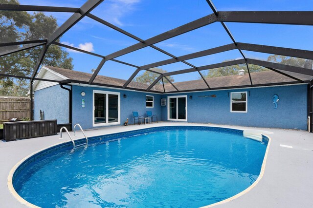 view of pool featuring a patio and a lanai