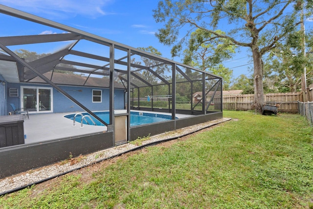 view of swimming pool featuring a yard and a lanai