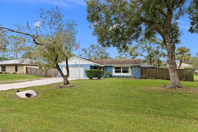 ranch-style home with a garage and a front lawn