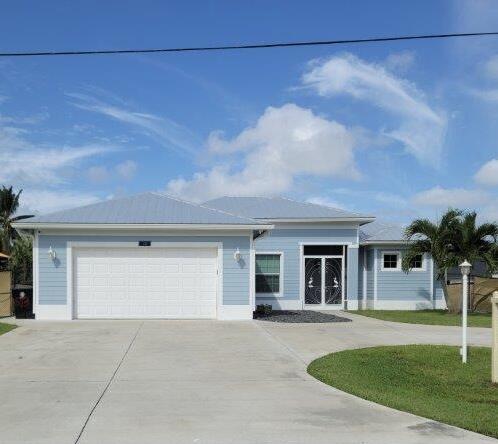 ranch-style house featuring a garage