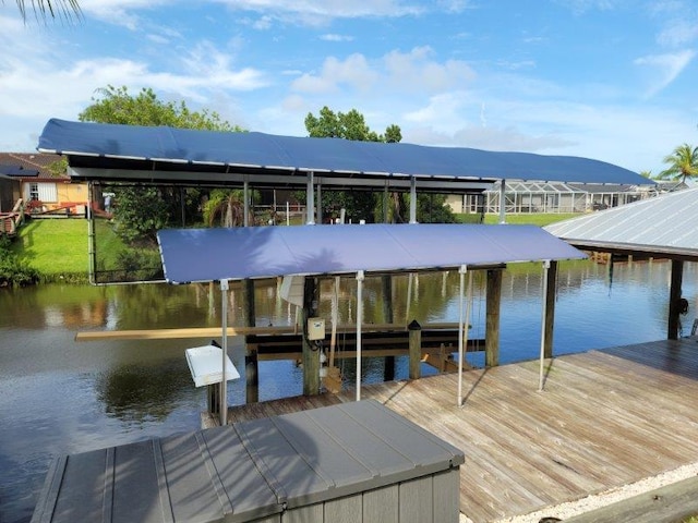 dock area featuring boat lift and a water and mountain view