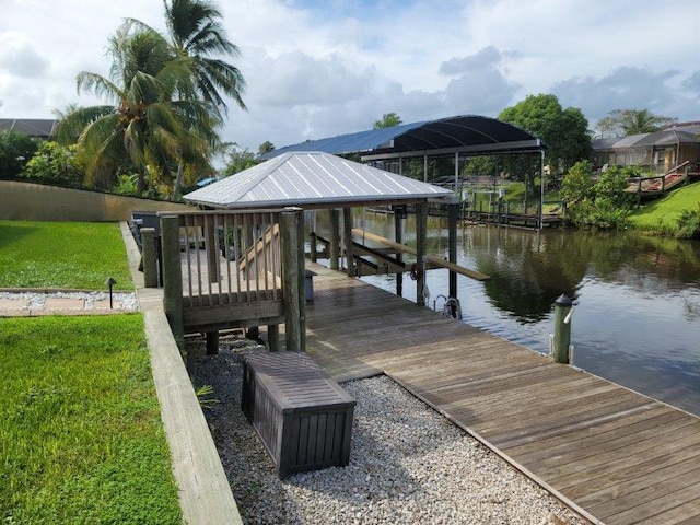 view of dock featuring a water view and boat lift