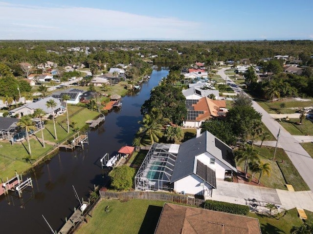 drone / aerial view with a water view and a residential view