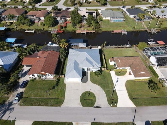 bird's eye view with a residential view and a water view