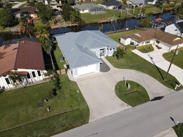 bird's eye view featuring a residential view and a water view