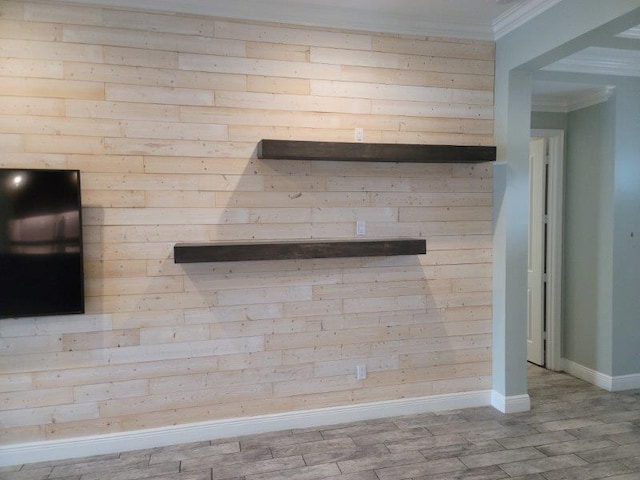 interior details with baseboards, wood finished floors, and crown molding