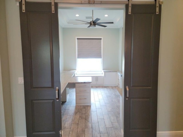 kitchen featuring a barn door, recessed lighting, light wood-style floors, coffered ceiling, and a ceiling fan