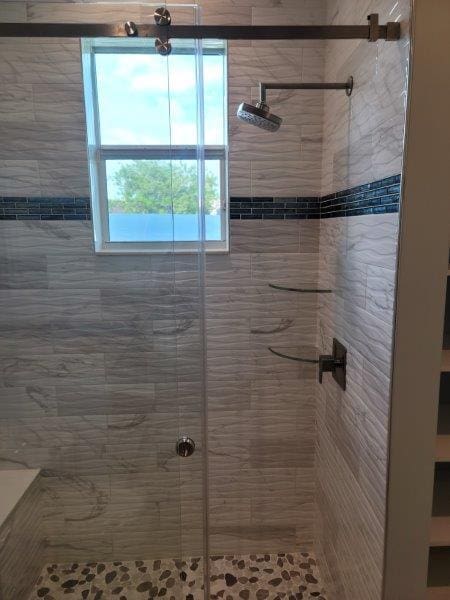 full bathroom featuring a stall shower