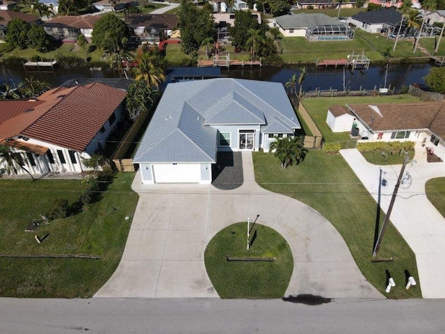 bird's eye view with a water view and a residential view