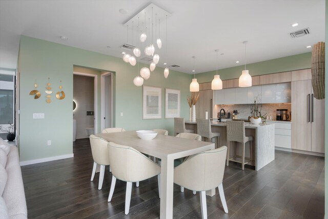 dining area featuring dark hardwood / wood-style floors