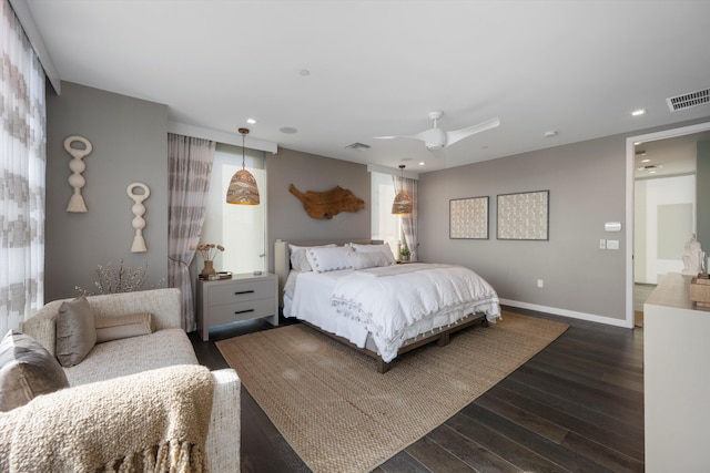 bedroom featuring ceiling fan and dark wood-type flooring