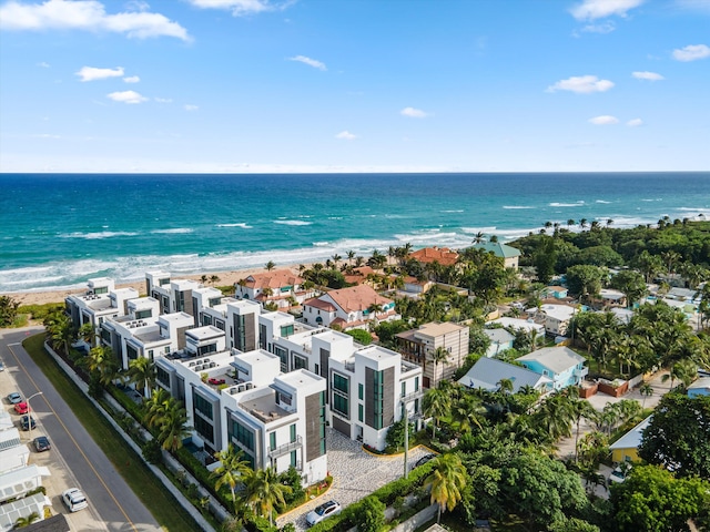 bird's eye view featuring a beach view and a water view