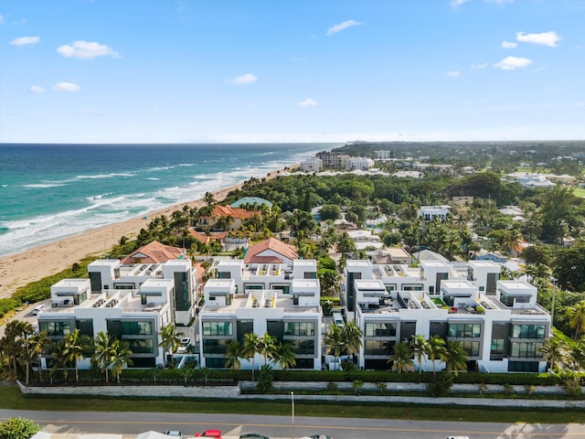 aerial view featuring a view of the beach and a water view