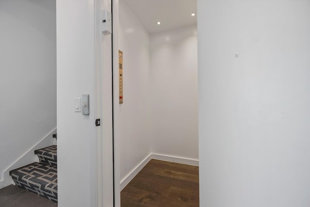 corridor featuring dark hardwood / wood-style floors and elevator