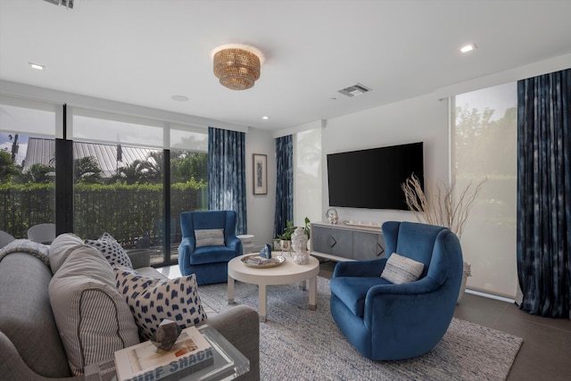 living room featuring a wall of windows