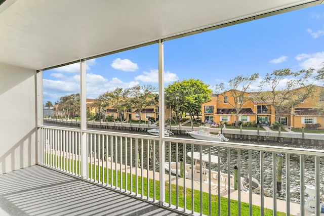 balcony featuring a water view