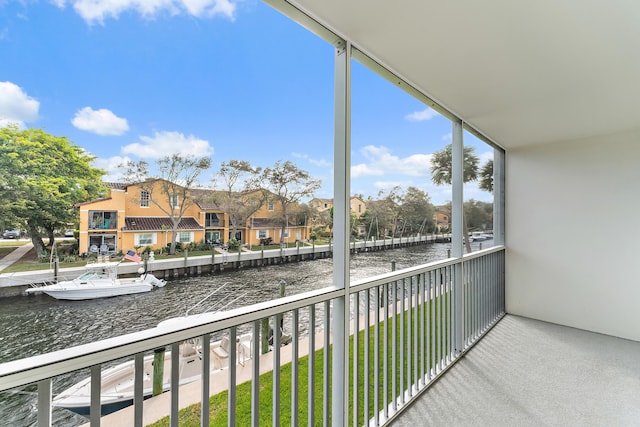 balcony featuring a water view