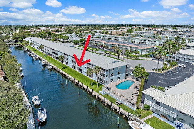 birds eye view of property featuring a water view