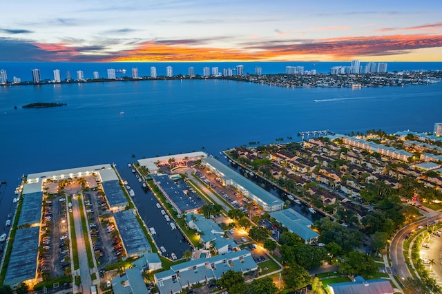 aerial view at dusk with a water view