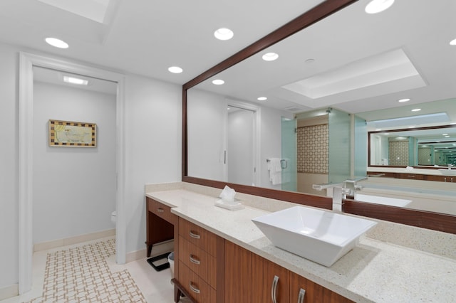 bathroom with vanity, toilet, and an enclosed shower