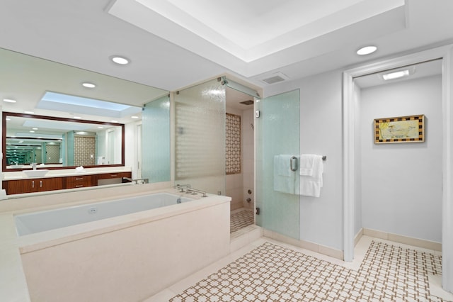 bathroom with vanity, tile patterned floors, and shower with separate bathtub