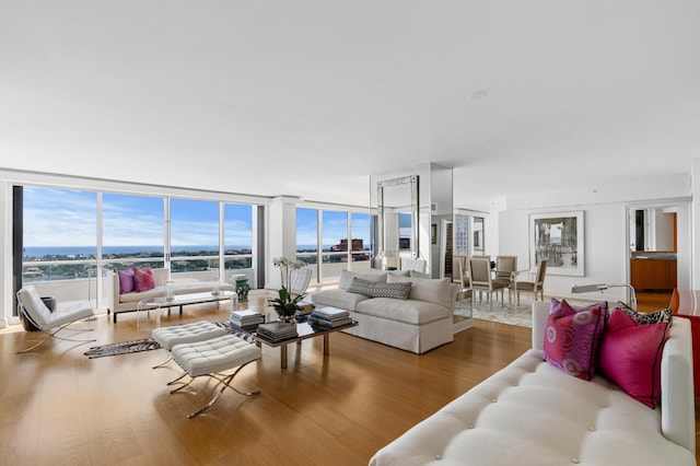 living room featuring hardwood / wood-style floors and a wall of windows