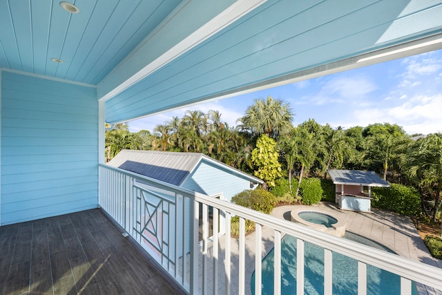 exterior space featuring an in ground hot tub