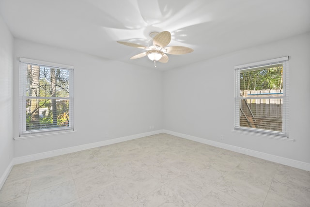 spare room featuring ceiling fan