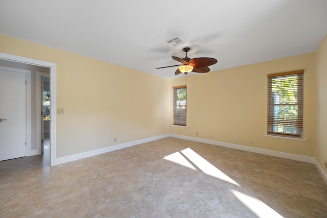 unfurnished room with ceiling fan