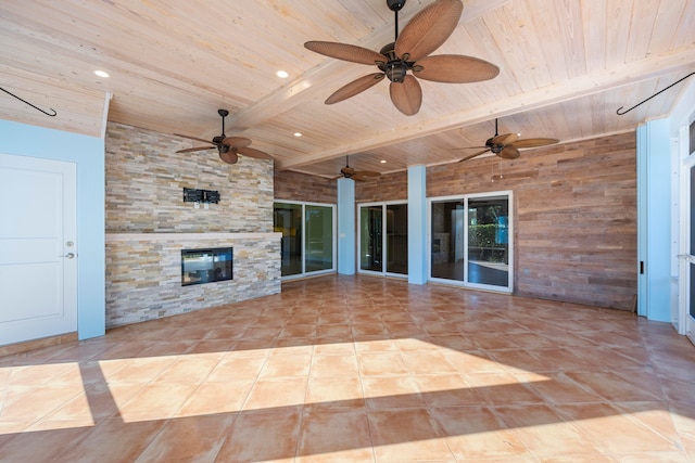 view of patio with a stone fireplace